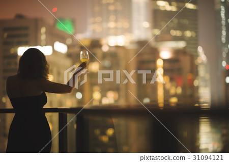 woman on the balcony Kuala Lumpur night city woman on the balcony Kuala Lumpur night city 31094121