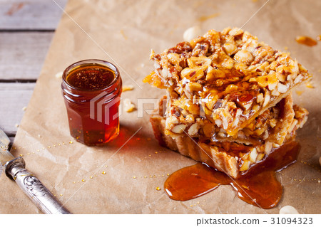 Caramel tart with nuts, maple syrup and honey. 31094323