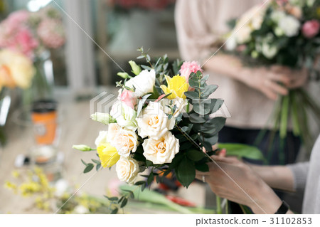 Workshop florist, making bouquets and flower Workshop florist, making bouquets and flower 31102853