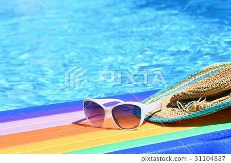 Sunglasses,lilo and hat on the water hot sunny day 31104887