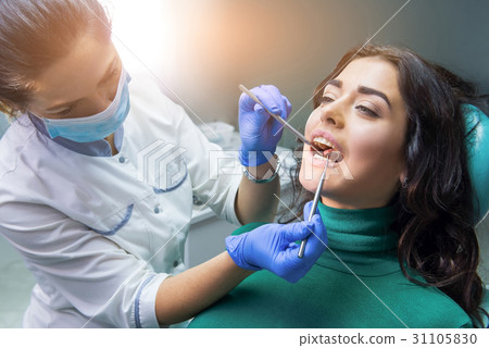Dentist lady at work. Dentist lady at work. 31105830