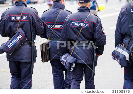 Policemen in uniform, rear view Policemen in uniform, rear view 31108576