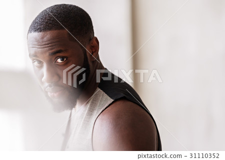 Thoughtful african bearded guy posing in Thoughtful african bearded guy posing in 31110352