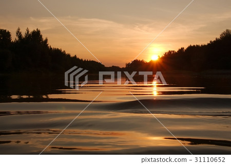 Sunset over a river 31110652