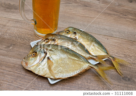 smoked Vomer and glass of beer on a wooden table smoked Vomer and glass of beer on a wooden table 31111008