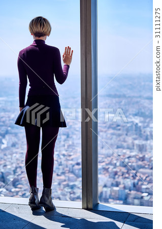 Young woman in the window Young woman in the window 31111275