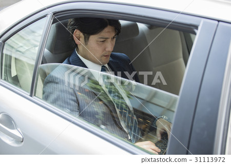 Young president who rides the back seat of the car 31113972