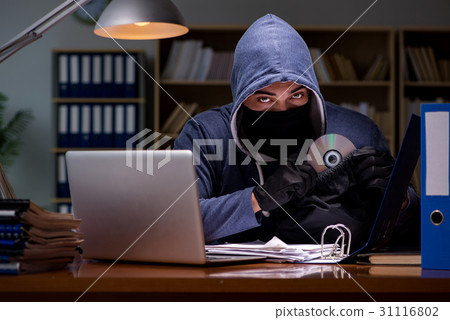 Hacker stealing personal data from home computer Hacker stealing personal data from home computer 31116802