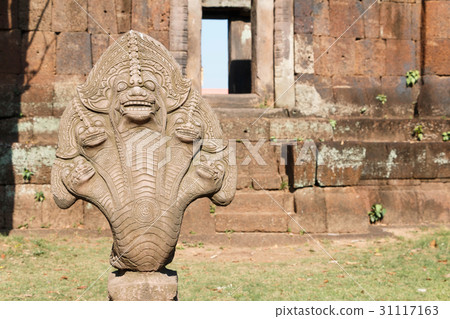 Stone nago statue. Stone nago statue. 31117163