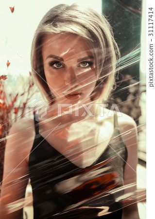 Close up portrait of a beautiful young woman with Close up portrait of a beautiful young woman with 31117414