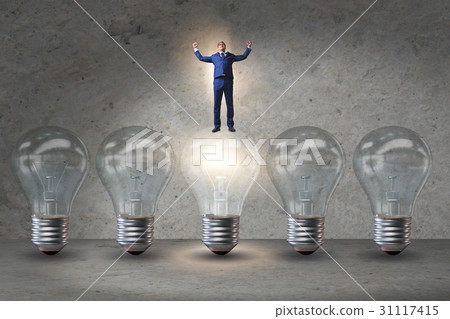 Businessman in new idea concept with light bulb 31117415
