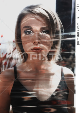 Close up portrait of a beautiful young woman with Close up portrait of a beautiful young woman with 31117417