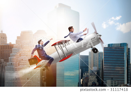 Businessman flying on vintage old airplane Businessman flying on vintage old airplane 31117418