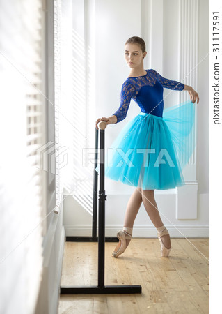 Ballerina is training on barre 31117591