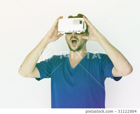 A man using a visualiaing reality gadget A man using a visualiaing reality gadget 31122804