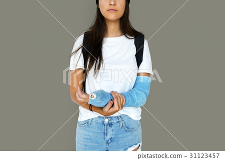 Young Adult Woman with Broken Arm Studio Portrait Young Adult Woman with Broken Arm Studio Portrait 31123457