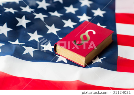 close up of american flag and lawbook 31124021