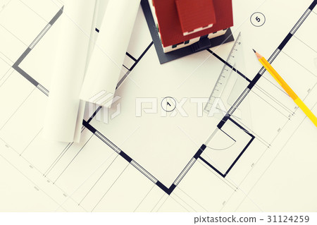 close up of house model on architectural blueprint 31124259