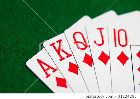 poker hand of playing cards on green casino cloth 31124283