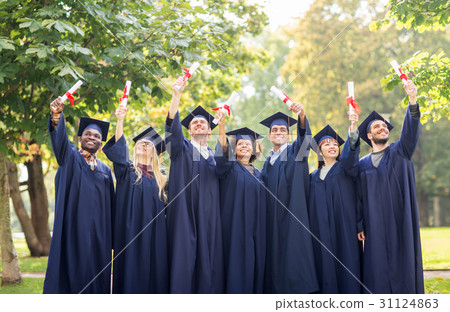happy students in mortar boards with diplomas happy students in mortar boards with diplomas 31124863