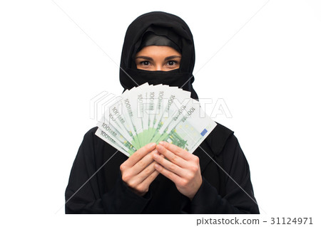 muslim woman in hijab with money over white 31124971
