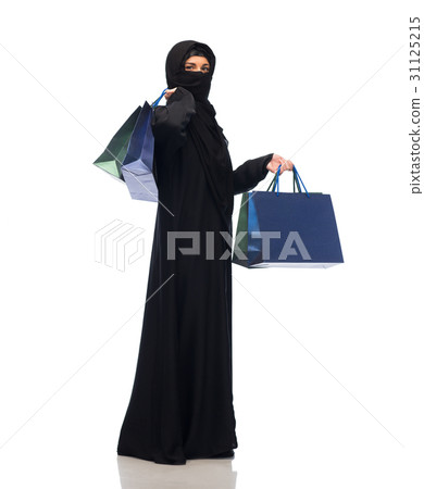 muslim woman in hijab with shopping bags 31125215