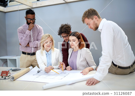 business team discussing house project at office 31126087