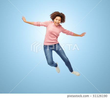 happy african american woman jumping over white 31126190