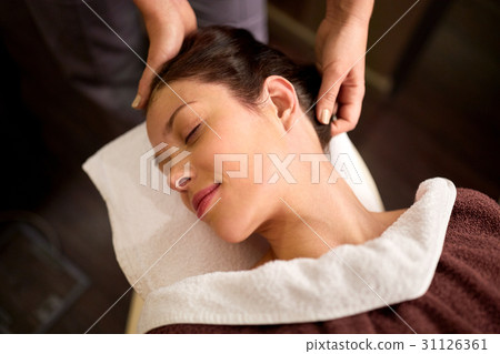 woman having head massage at spa woman having head massage at spa 31126361
