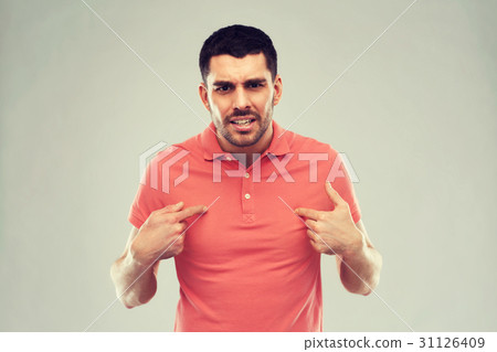 angry man pointing finger to himself over gray 31126409