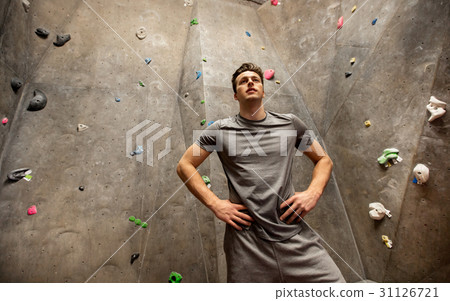 young man exercising at indoor climbing gym 31126721