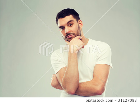 man thinking over gray background man thinking over gray background 31127088