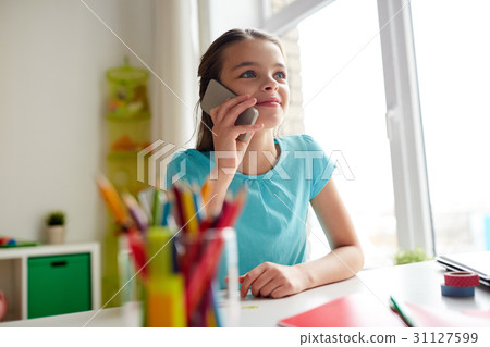 girl calling on smartphone at home 31127599