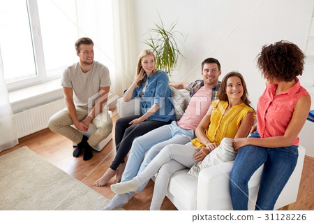 group of happy friends talking at home group of happy friends talking at home 31128226