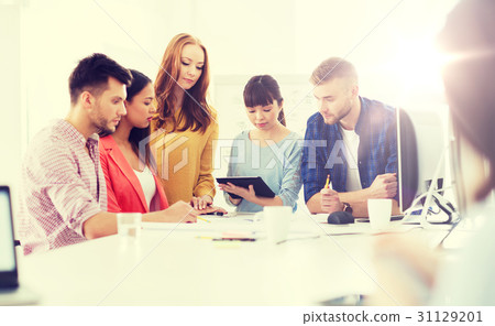 creative team with blueprint working at office 31129201