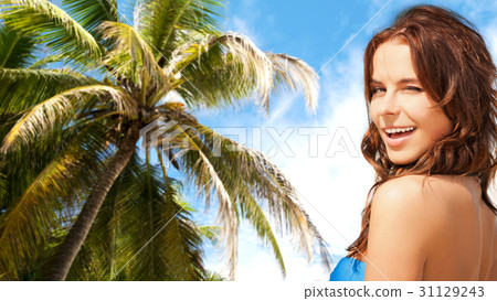 happy smiling woman winking over summer beach happy smiling woman winking over summer beach 31129243