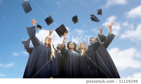 happy students throwing mortar boards up 31129299