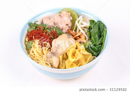 Boiled noodle and wonton in spicy sour soup. 31129582