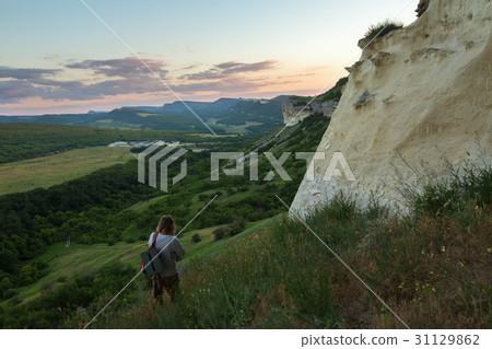Tourist walks along the slope of the Cave city Tourist walks along the slope of the Cave city 31129862