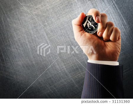 Compass in male hand 31131360