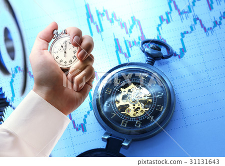 Candlestick chart, watch and stopwatch in hand Candlestick chart, watch and stopwatch in hand 31131643