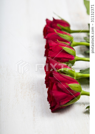 Red roses on a wooden background. Red roses on a wooden background. 31132371