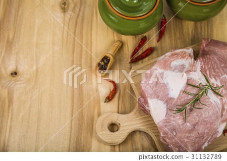 Pork and pots on the table. Cooking. 31132789