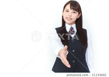 A young woman in a suit seeking a handshake A young woman in a suit seeking a handshake 31134892