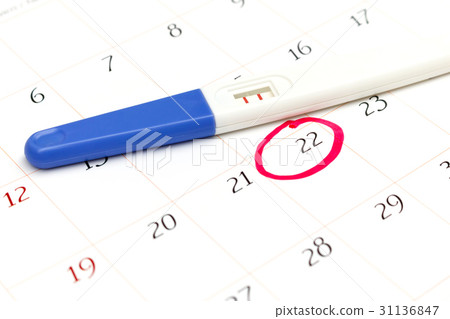 Pregnancy test with positive result on calendar Pregnancy test with positive result on calendar 31136847