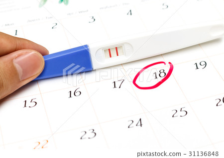 Pregnancy test with positive result on calendar 31136848