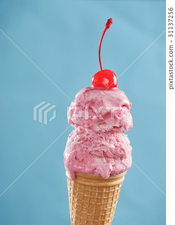 Pink ice cream cone with cherry 31137256