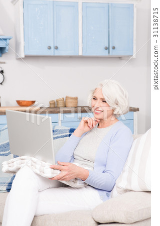 Grandmother using laptop computer 31138715