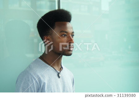 city portrait young man waiting  city winwow 31139380