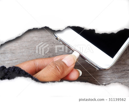 Smartphone charger with paper torn Smartphone charger with paper torn 31139562